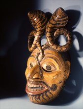 A dance mask representing the spirit of the cobra from the great Ramayana epic