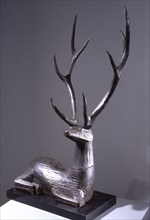 Wooden sculpture of a deer
