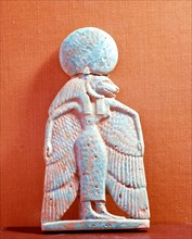 Faience low relief plaque of a winged, lion headed goddess