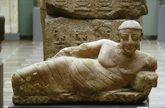Statue of a reclining man found in a bath house at Meroe