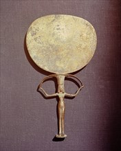 Bronze mirror with the handle in the form of a naked woman