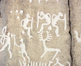 Petroglyphs; figures brandishing weapons