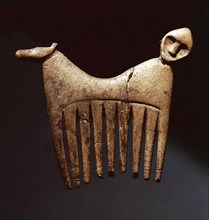 Comb decorated with a human and animal head