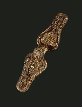 Brooch richly decorated with animals, human beings and gilt details