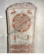Memorial picture stone decorated with whorls symbolising the sun and vignettes from the hunt