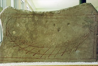 Limestone stele incised with design of a boat