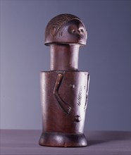 Among a number of cultures in coastal Tanzania, wooden figures of this cylindrical form, known as Mwana Hiti, were worn by girls undergoing initiation
