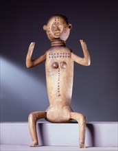 Seated female figure with articulated limbs