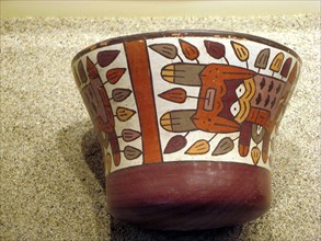 Polychrome ceramic kero showing the mythical spotted cat creature