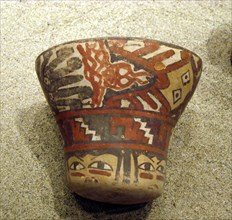 Polychrome ceramic kero showing octopus like creatures and human faces
