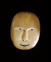 Plug from a drag float, carved in ivory in the form of a human face
