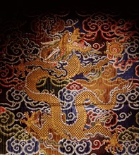 Embroidered textile with dragon design
