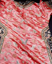 Detail of a dress embroidered with butterfly motifs