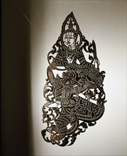 Shadow puppet depicting deity with the Hindu monkey god Hanuman