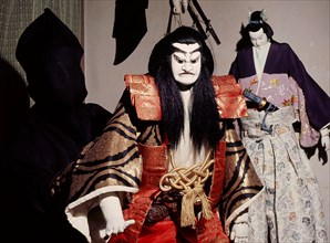 Bunraku puppet and hooded puppet master