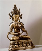 A statue of the Buddha sitting in the lotus position
