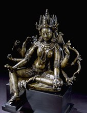 Sculpture of an eight armed female deity, probably Usnisavijaya the goddess of longevity, wearing an unusual mountain crown