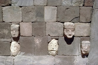 Five tenoned head sculptures embedded in the interior wall of the Semi subterranean Temple