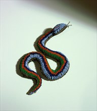 Beaded buckskin pouch in the form of a snake
