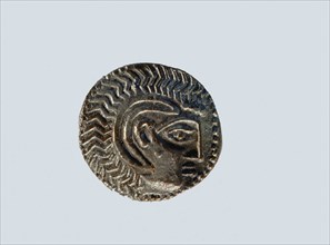 One of a group of silver coins in both Greek and local styles found at Ad Dour in Umm al Qawain Emirate, indicating a flourishing foreign trade
