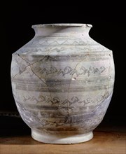 Grey pottery vessel decorated with panels of animal designs, from the Hili tombs