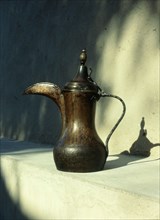 Brass hornbill spouted coffee pot, dallah, of the type once found throughout the Emirates