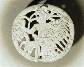 Shell gorget depicting a flying shaman with the wings and talons of a bird of prey