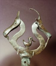 Ornament in the shape of a pair of horses heads