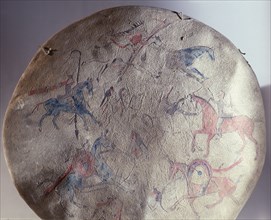 Shield cover showing a battle between Indians and White Men