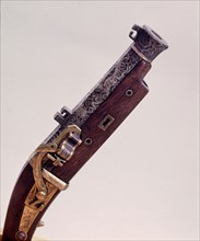 Gun with dragon and cloud design inlaid in silver