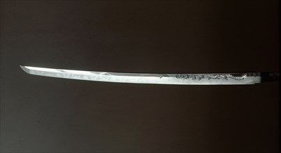 Sword (katana) blade carved with  an ascending dragon