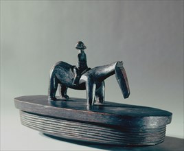 A Lozi presentation food dish with an equestrian figure on the lid