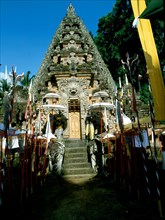 The covered gate at a temple in Ubud adorned for a festival