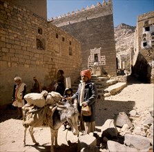 yemeni man with his donkey