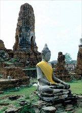 The temple ruins of Wat Chaiwatthanaram and Buddha statue