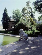 Stone lions at the pool of the Partal in front of the Torre de las Damas, Alhambra Palace, Granada