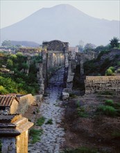 Tombs beyond the walls of Pompeii, with Vesuvius in the background