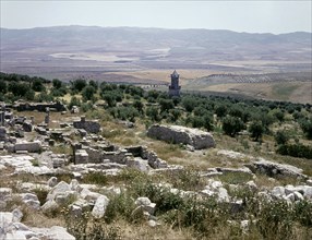 A Numidian Berber tomb built by Punic craftsmen seen from the ruins of the Roman city of Dougga