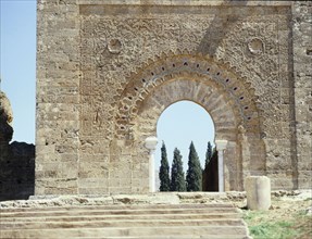 The gateway into the courtyard of the ruined mosque of al-Mansura is set in the base of the minaret