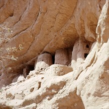 The mouths of burial caves used by the Tellem in the sheer face of the Bandiagara cliffs near Sanga