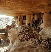 Mud tombs inside burial caves used by the Tellem in the sheer face of the Bandiagara cliffs near Sanga