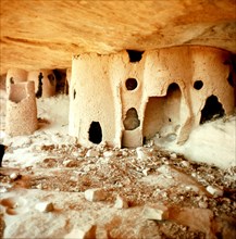 Mud tombs inside burial caves used by the Tellem in the sheer face of the Bandiagara cliffs near Sanga