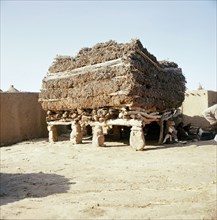 Aligned to the four cardinal points and roofed by a thick layer of millet stalks, the men's house or Togu Na, is the focal point of male society in every Dogon village