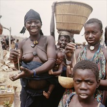 Dogon women and children at market