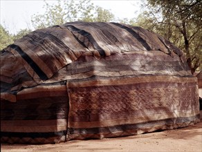 A tent walled with woven fibre mats in the Niger capital, Niamey