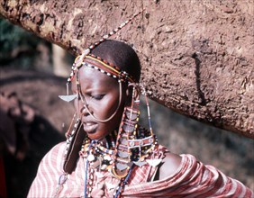 The elaborate beadwork of this Masai woman indicates her ethnic identity, social status, and the number and status of her children