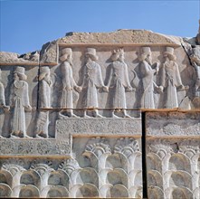 A detail of a relief carving on the staircase leading to the Tripylon at Persepolis, depicting the procession of Medes and Persians