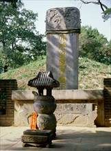 The stone stele and burial mound at the tomb of Confucius