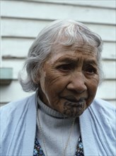 An elderly Maori woman, reputed to be the last survivor with facial tattooing