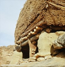 Aligned to the four cardinal points and roofed by a thick layer of millet stalks, the men's house or Togu Na, is the focal point of male society in every Dogon village